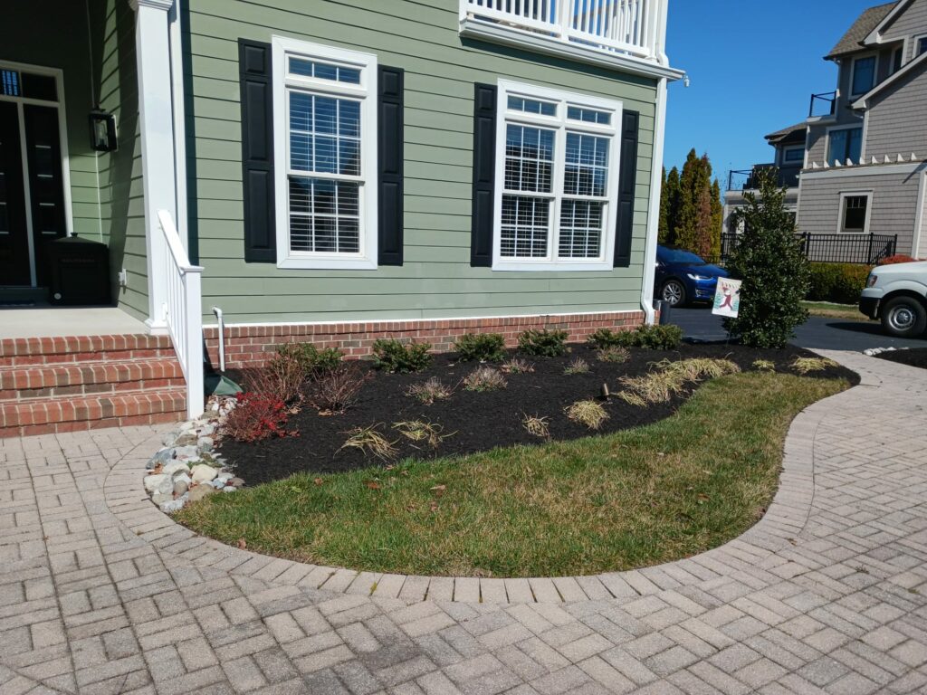 Landscaped front yard with manicured beds