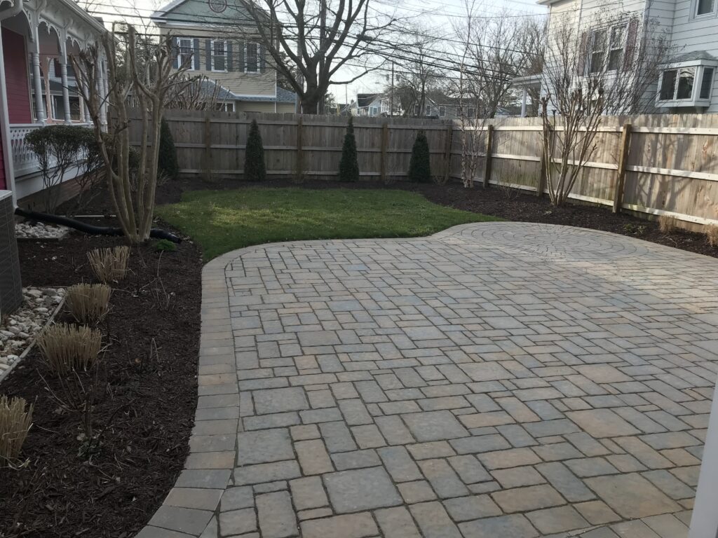 Mulched bed and pruned shrubs